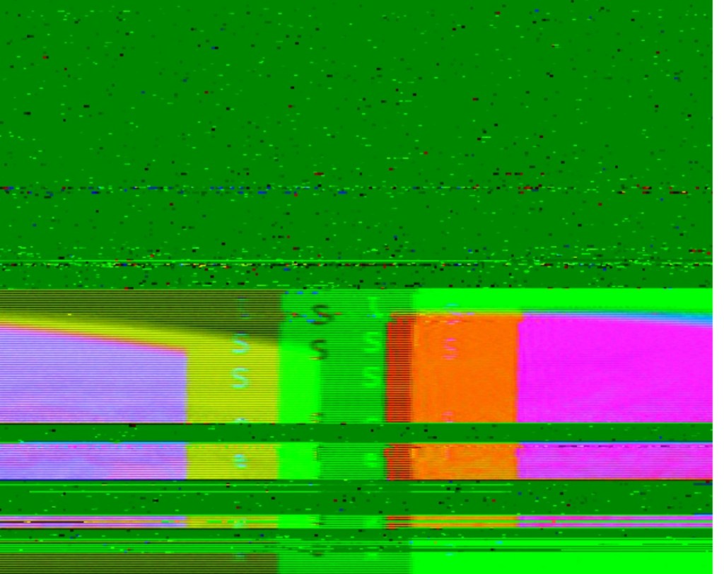 A garbled image, mostly bright green with some magenta, red, yellow, and purple blobs at the bottom, and partial text visible with the letters ISS visible.